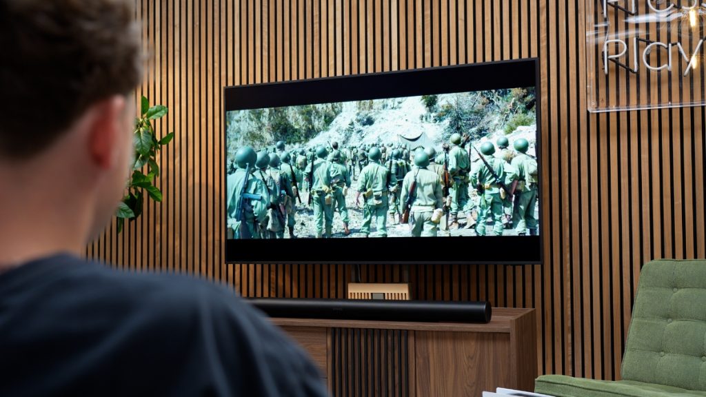 Samsung Frame TV being watched by a man
